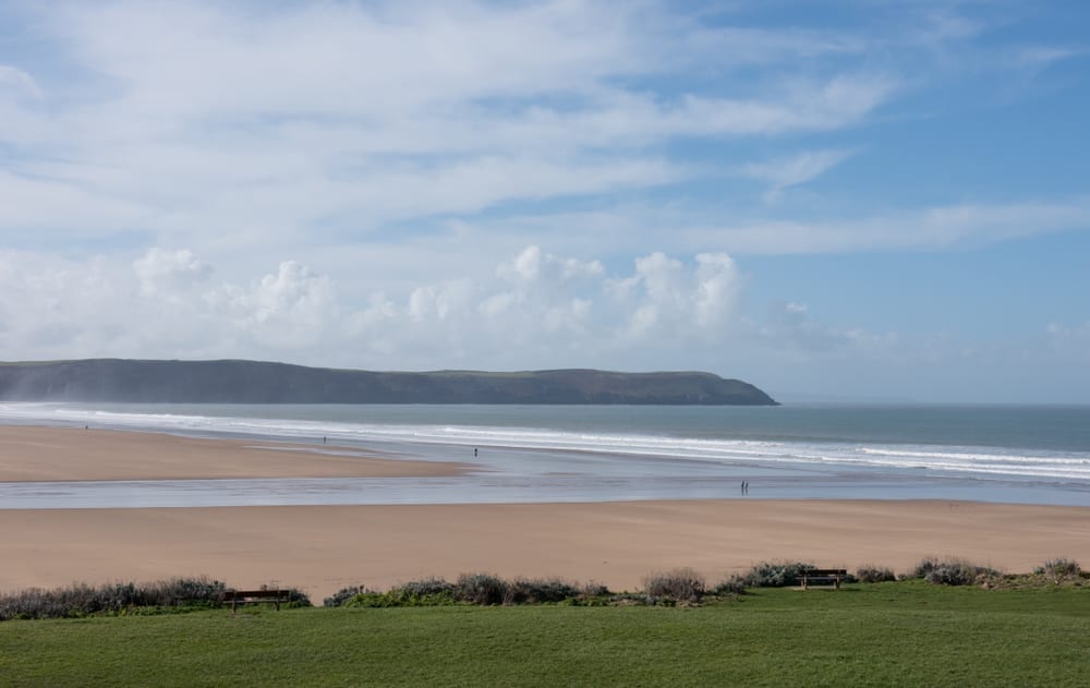 The Golden Sands of Woolacombe Beach at Low Tide on the Atlantic Ocean in North Devon, England, UK