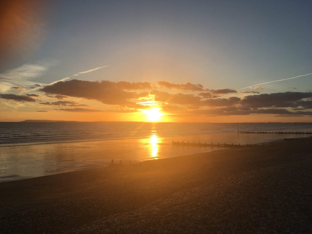 Sun going down over Bracklesham bay beach