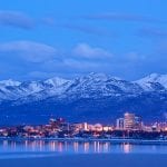 Anchorage Alaska skyline in winter at dusk with the Chugach mountains behind