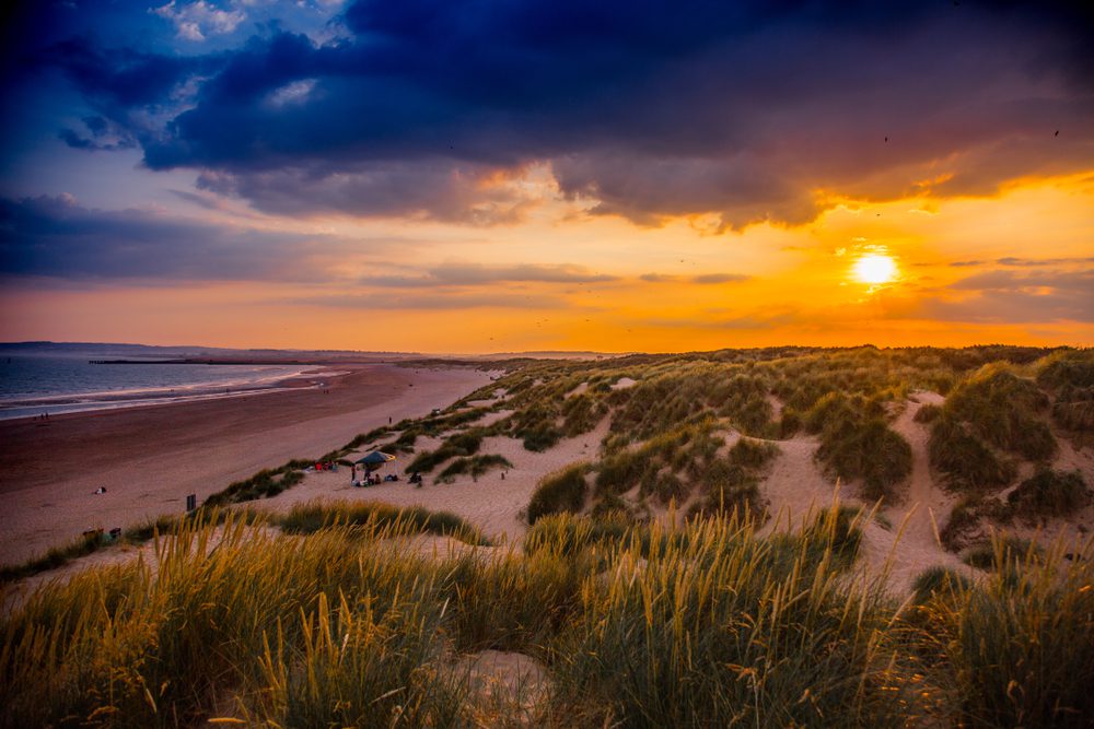 Sunset over Camber Sands beach in England