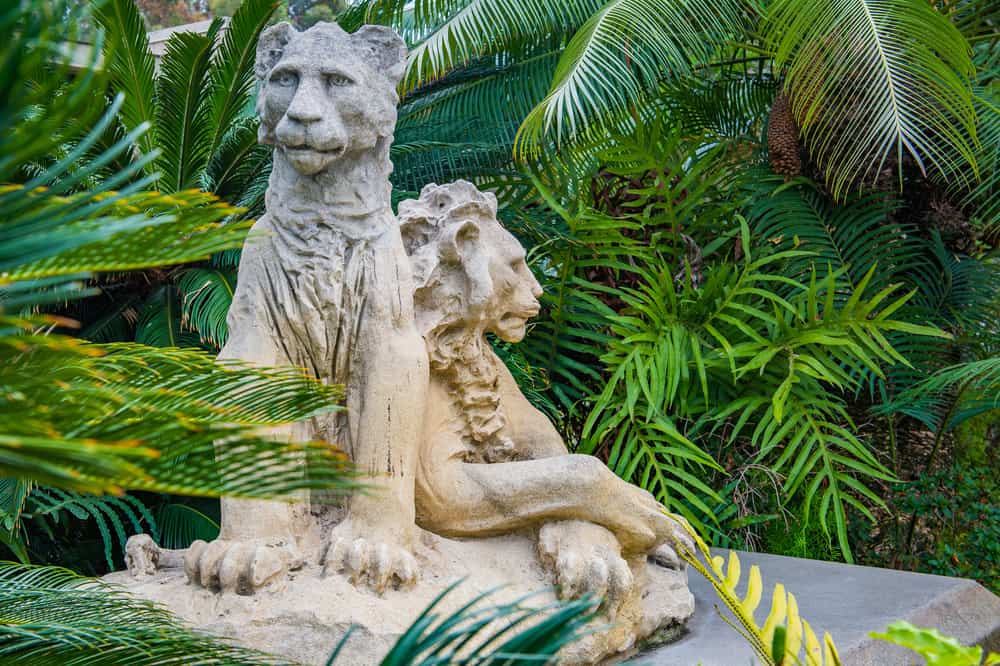 A Rustic Sculpture of Two Stylized Lions Among Palm Fronds Inside the Los Angeles Zoo.