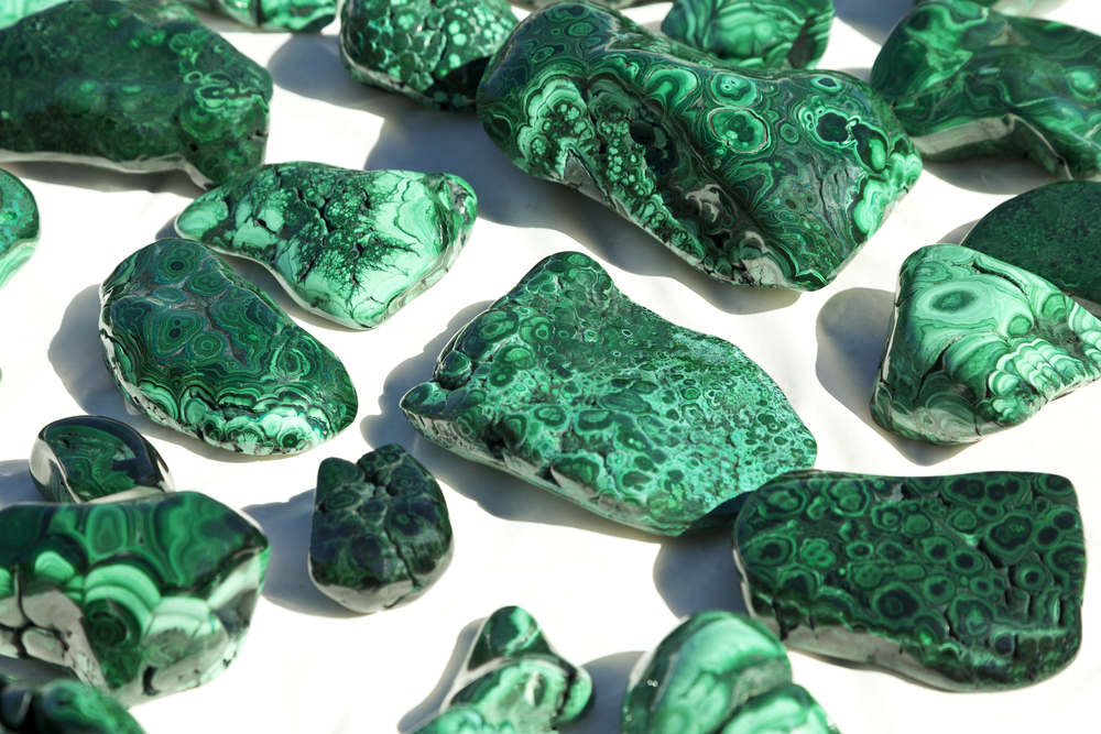 Beautiful hues of malachite mineral specimens on sale at Tucson Gem, Mineral, and Fossil Show, an international event