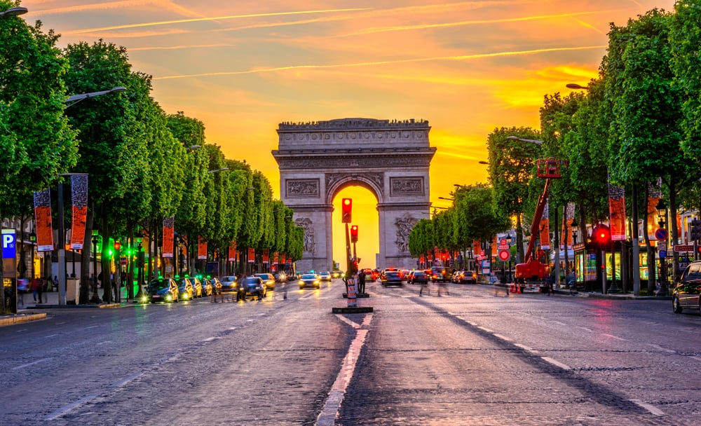 Champs-Elysees and Arc de Triomphe at night in Paris, France.